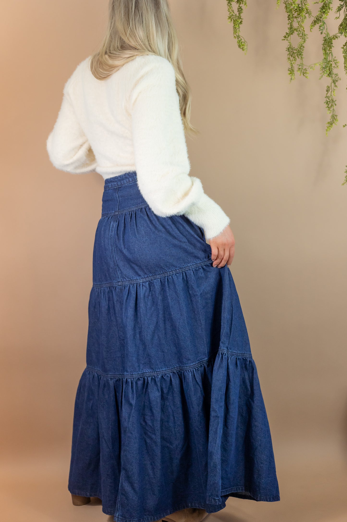 woman's blue denim maxi length skirt back