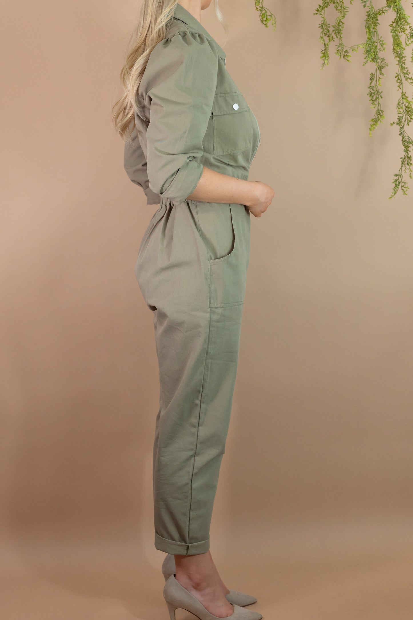 woman's army green utility long sleeve zipper jumpsuit with pockets cinch waist side view