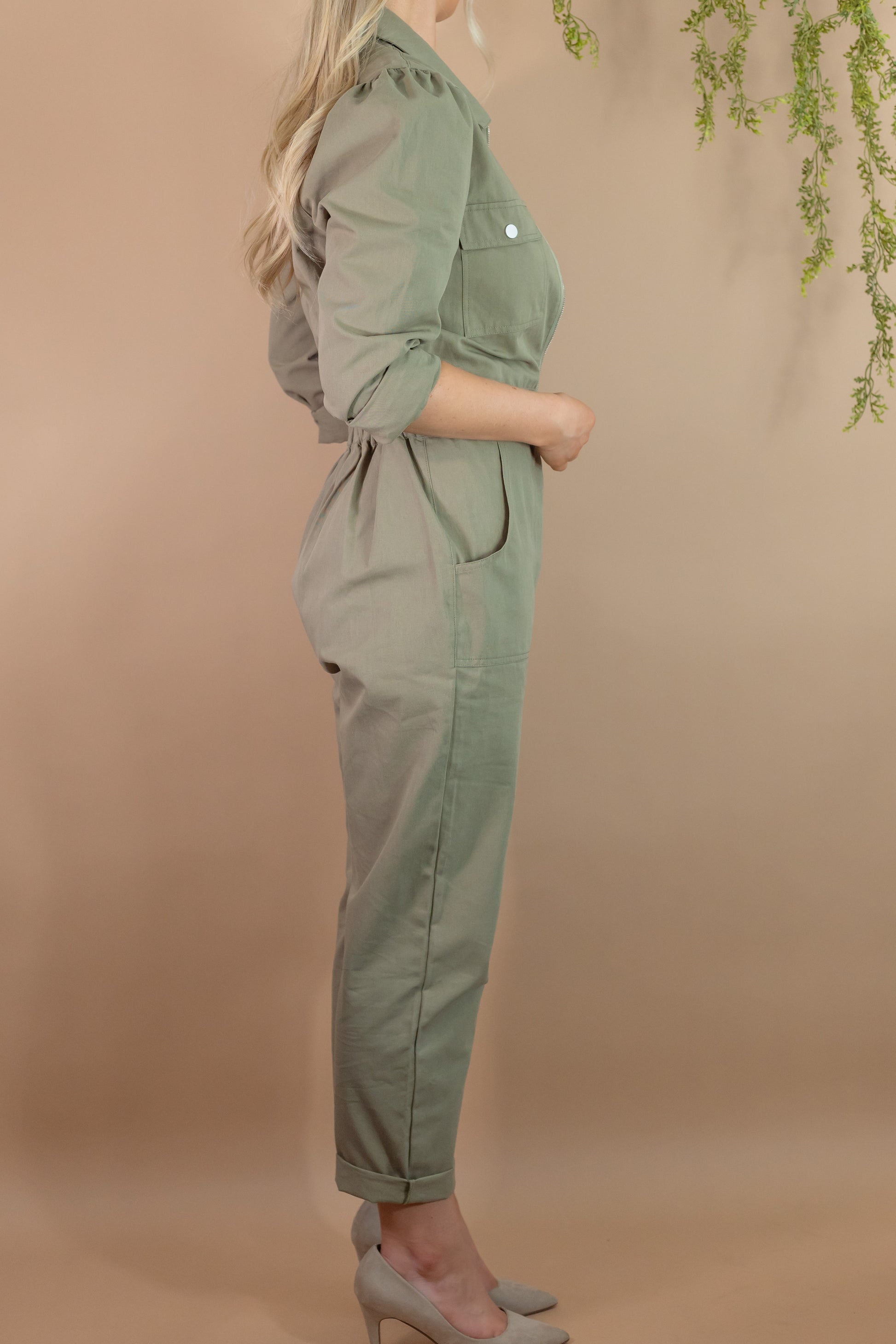 woman's army green utility long sleeve zipper jumpsuit with pockets cinch waist side view