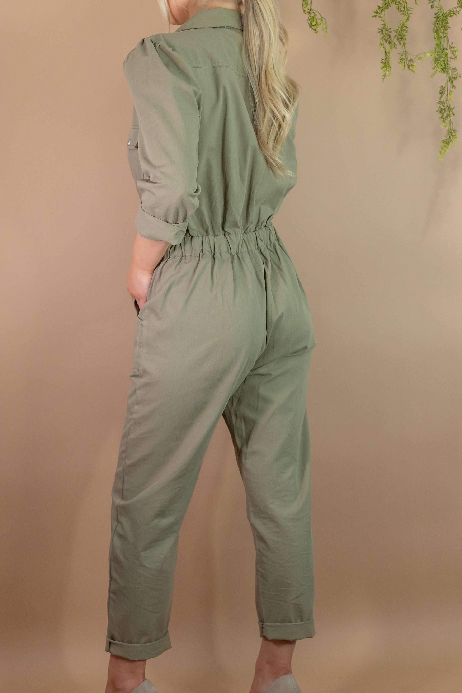 woman's army green utility long sleeve zipper jumpsuit with pockets back view