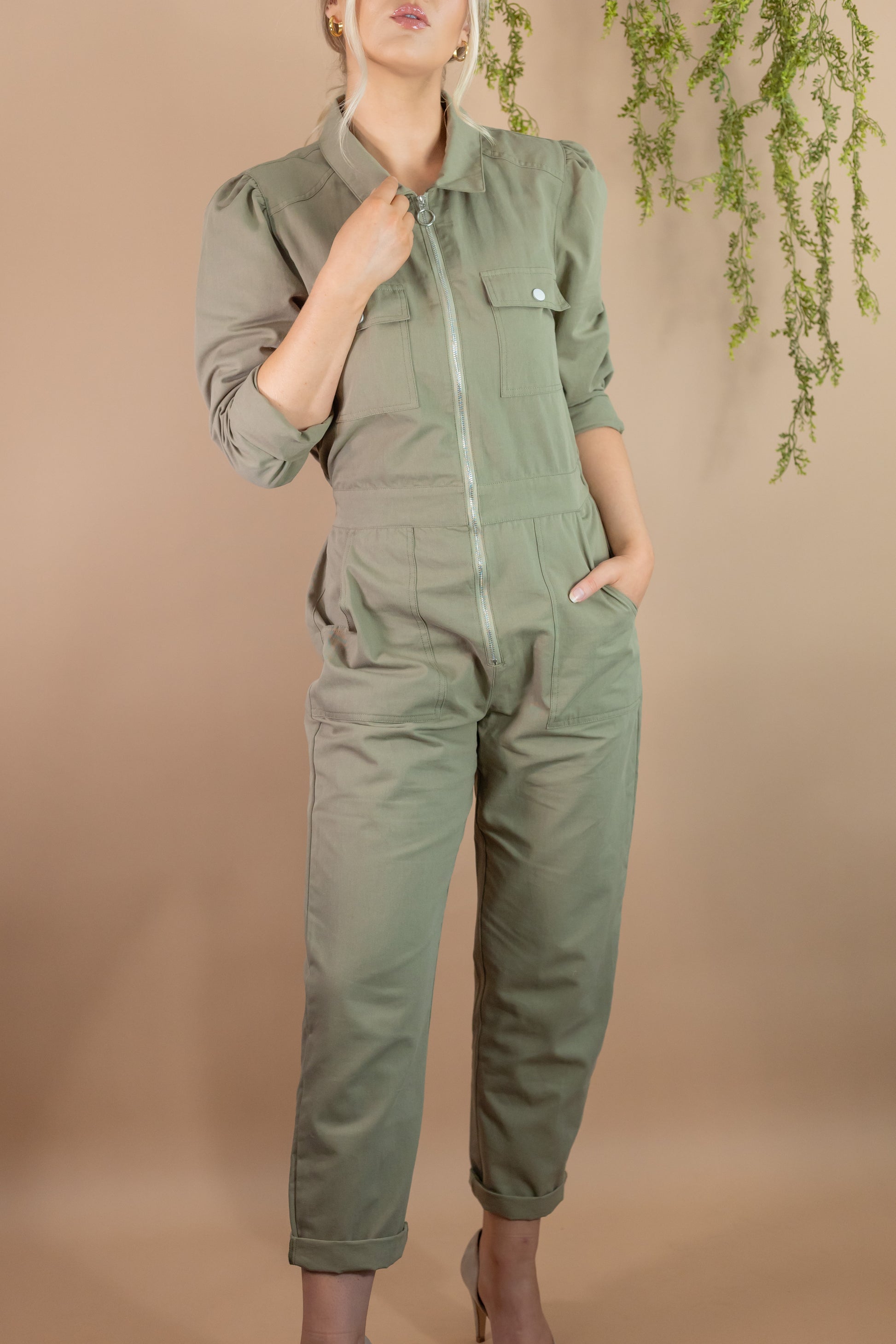 woman's army green utility long sleeve zipper jumpsuit with pockets cinch waist collar puff shoulders
